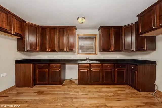 a kitchen with stainless steel appliances granite countertop a stove a sink and a granite counter tops