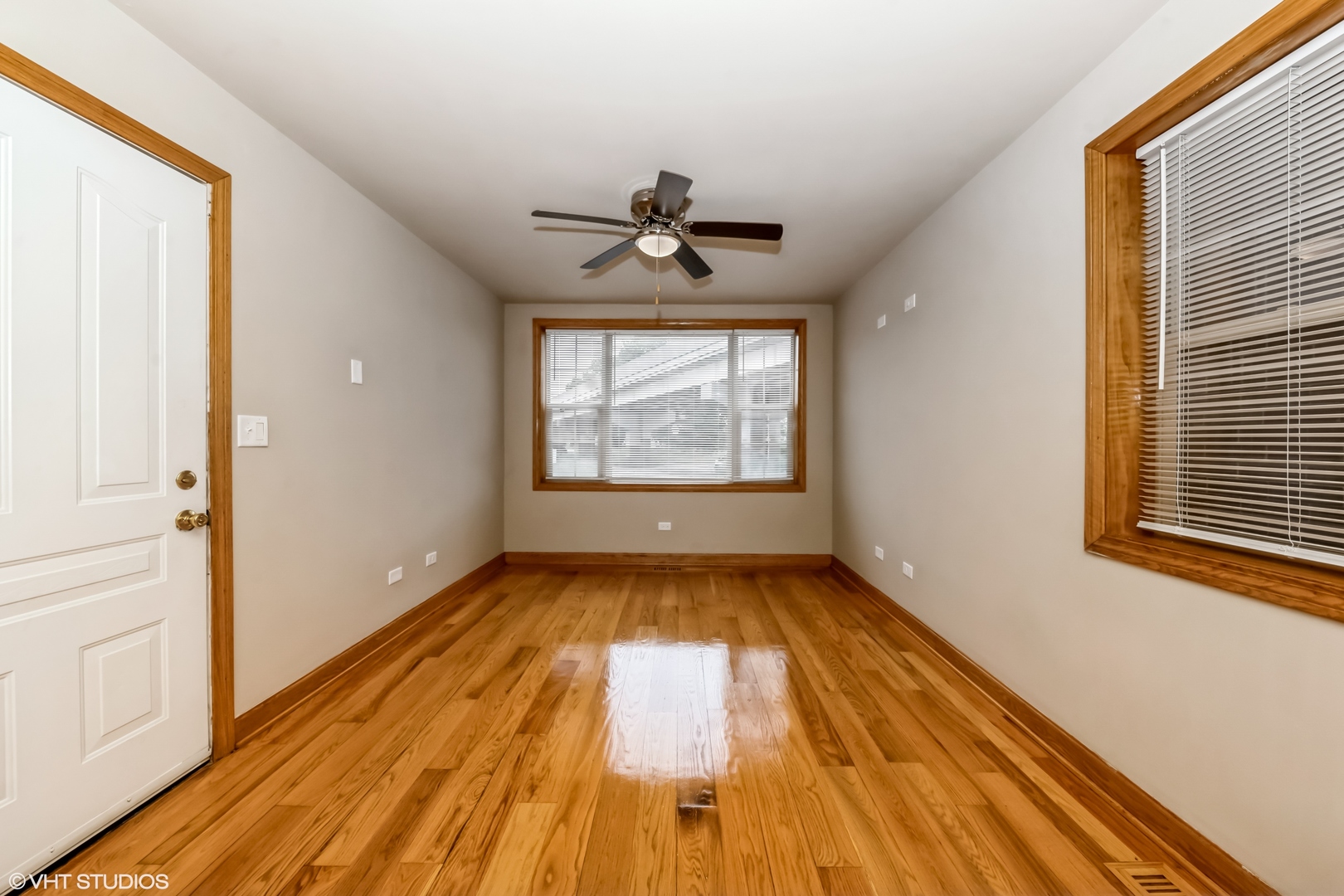 5316 South Kenneth Avenue, Unit 101 Chicago, IL 60632 - Photo 6 of 15 wooden floor in an empty room with a window