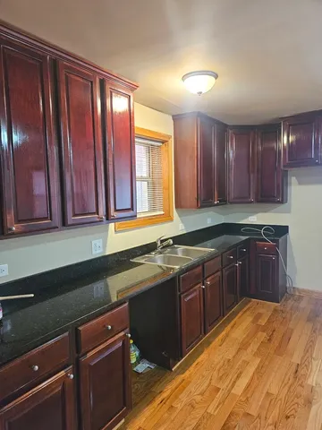 a kitchen with a sink and cabinets