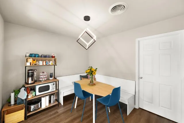 a workspace with furniture and wooden floor