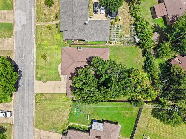 an aerial view of a house with a garden and plants
