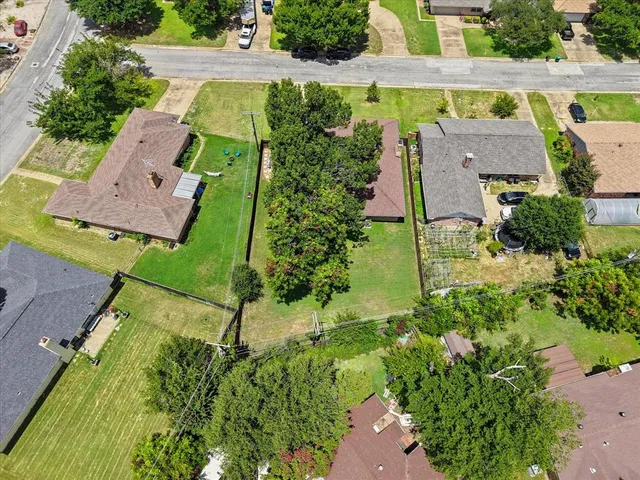 an aerial view of a house with a garden