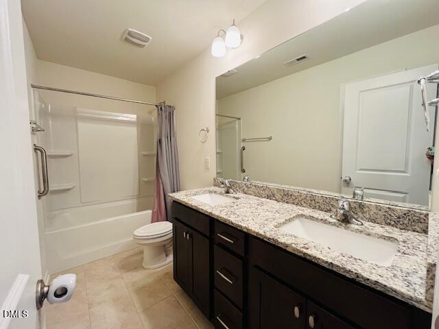 1423 Compass Drive Durham, NC 27713 - Photo 12 of 19 a bathroom with a granite countertop sink toilet mirror and shower