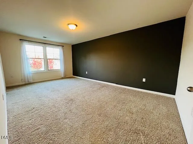 a bathroom with a granite countertop sink a mirror and a shower