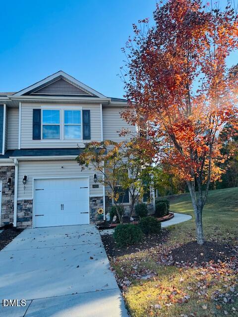 1423 Compass Drive Durham, NC 27713 - Photo 2 of 19 a front view of a house with garden