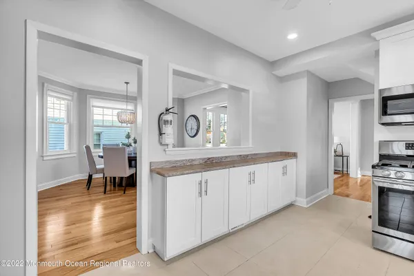 a kitchen with granite countertop a stove and a sink