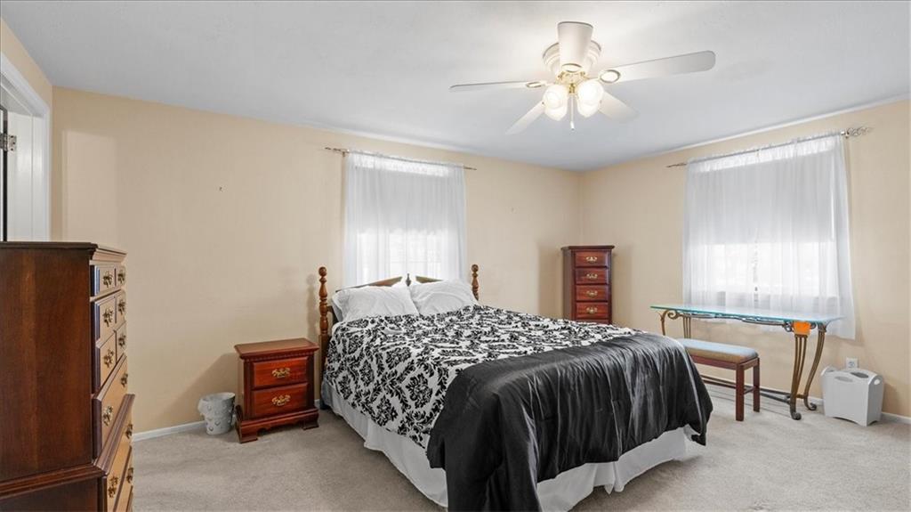 205 Camelford Road McMurray, PA 15317 - Photo 16 of 32 a bedroom with a bed and a chandelier