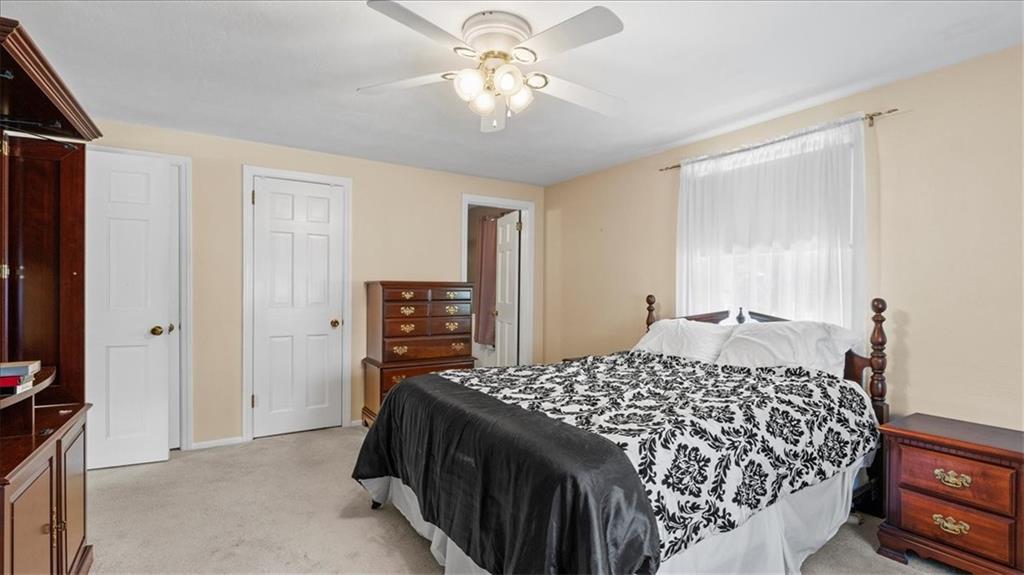 205 Camelford Road McMurray, PA 15317 - Photo 17 of 32 a bedroom with a bed and a chandelier