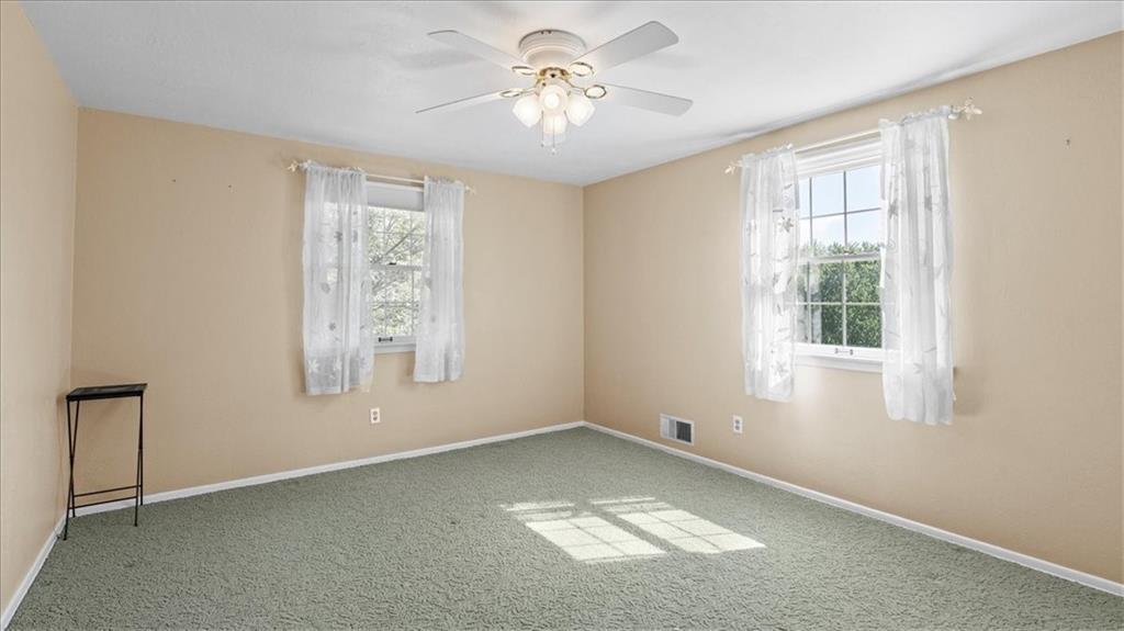 205 Camelford Road McMurray, PA 15317 - Photo 18 of 32 a view of empty room with window and chandelier fan