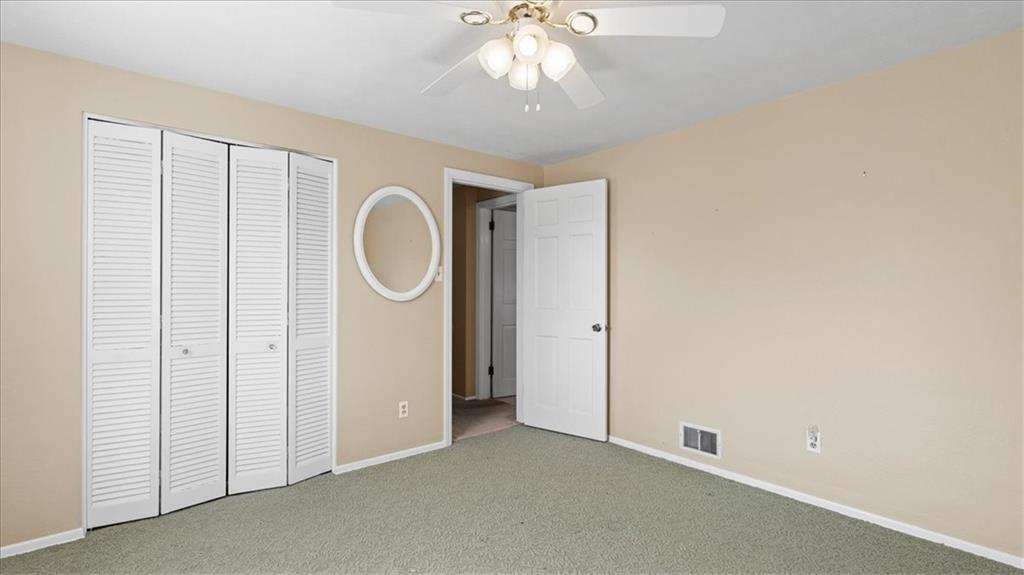 205 Camelford Road McMurray, PA 15317 - Photo 19 of 32 an empty room with a chandelier fan and a window