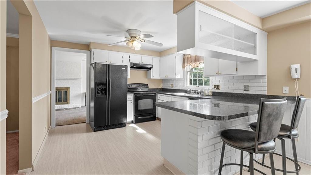 205 Camelford Road McMurray, PA 15317 - Photo 7 of 32 a kitchen with granite countertop a center island stainless steel appliances cabinets and a window