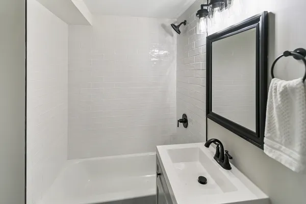 a bathroom with a sink and mirror