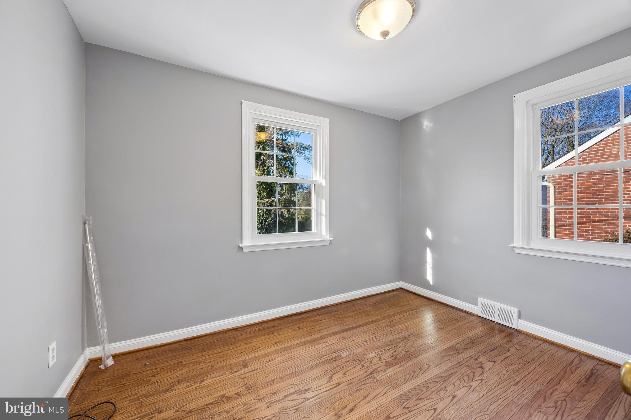 336 Valley View Road Springfield, PA 19064 - Photo 11 of 24 a view of empty room with wooden floor and fan