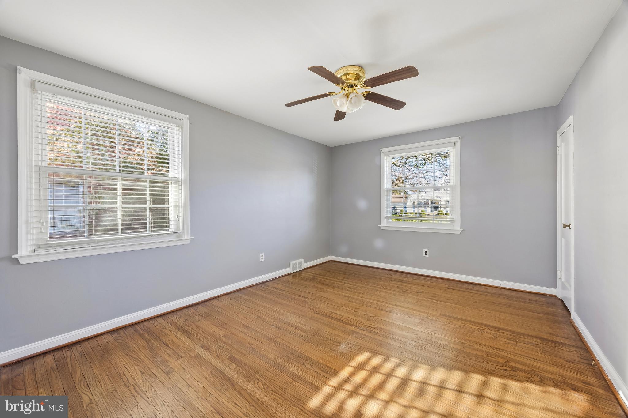 336 Valley View Road Springfield, PA 19064 - Photo 13 of 24 a view of an empty room with a window and a ceiling fan