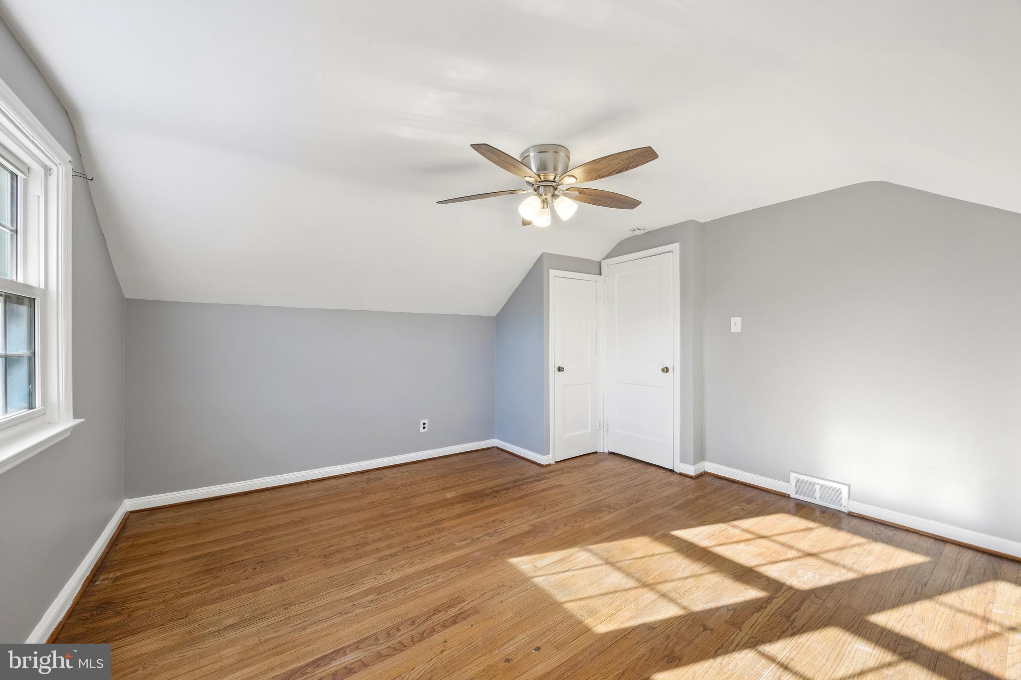 336 Valley View Road Springfield, PA 19064 - Photo 20 of 24 a view of a big room with wooden floor and a chandelier fan