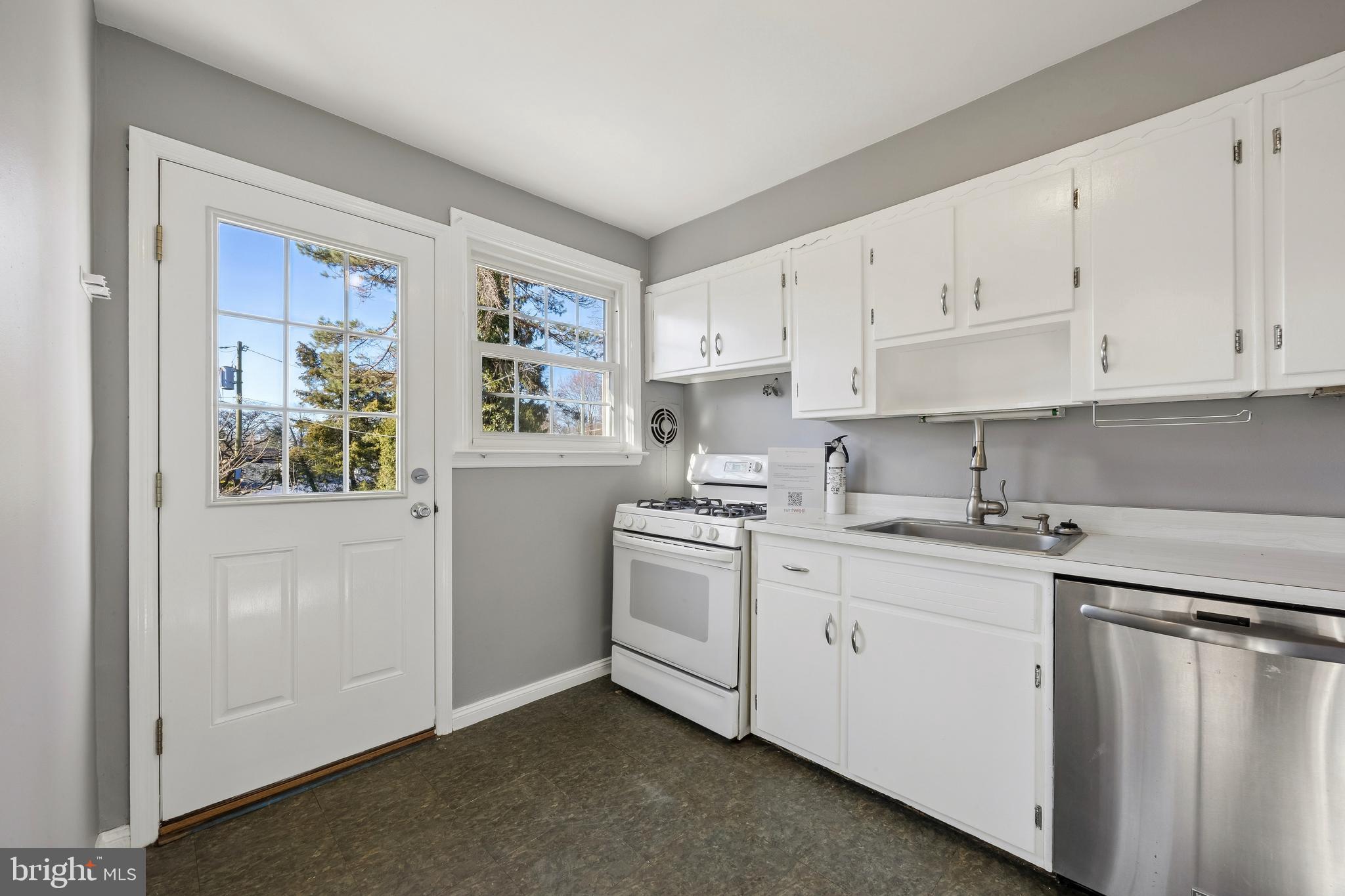 336 Valley View Road Springfield, PA 19064 - Photo 9 of 24 a kitchen with white cabinets and white appliances