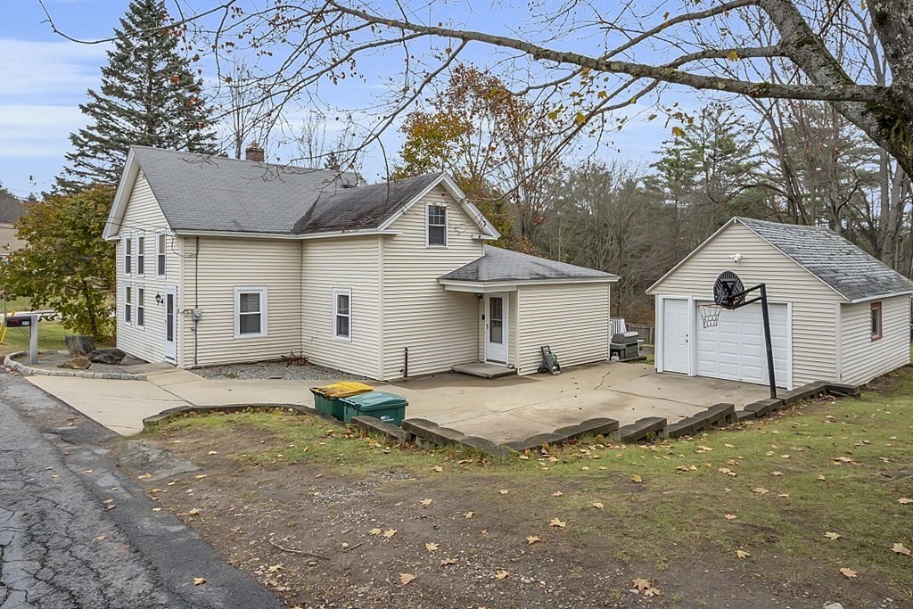 21 River Road Templeton, MA 01436 - Photo 2 of 26 a big house with table and chairs under an umbrella