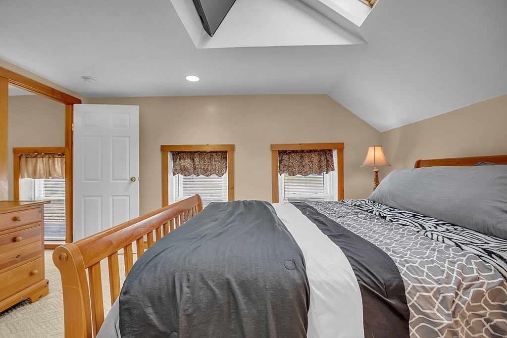 21 River Road Templeton, MA 01436 - Photo 22 of 26 a bedroom with a large bed and two windows
