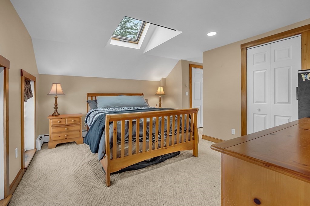 21 River Road Templeton, MA 01436 - Photo 23 of 26 a bedroom with a bed and a cabinets