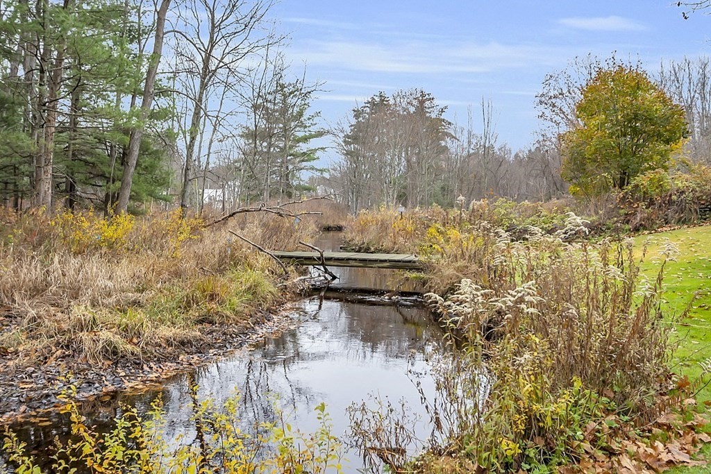 21 River Road Templeton, MA 01436 - Photo 26 of 26 a backyard of a house with lots of green space and fog