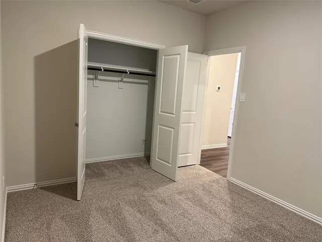an empty room with closet