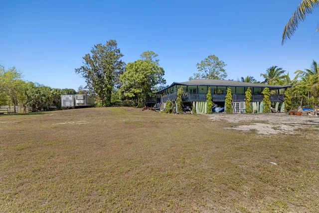 a view of a field with an ocean view