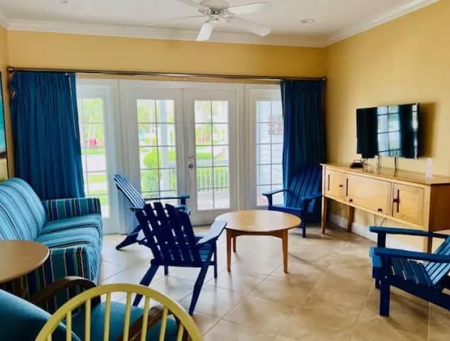 a living room with furniture and a flat screen tv