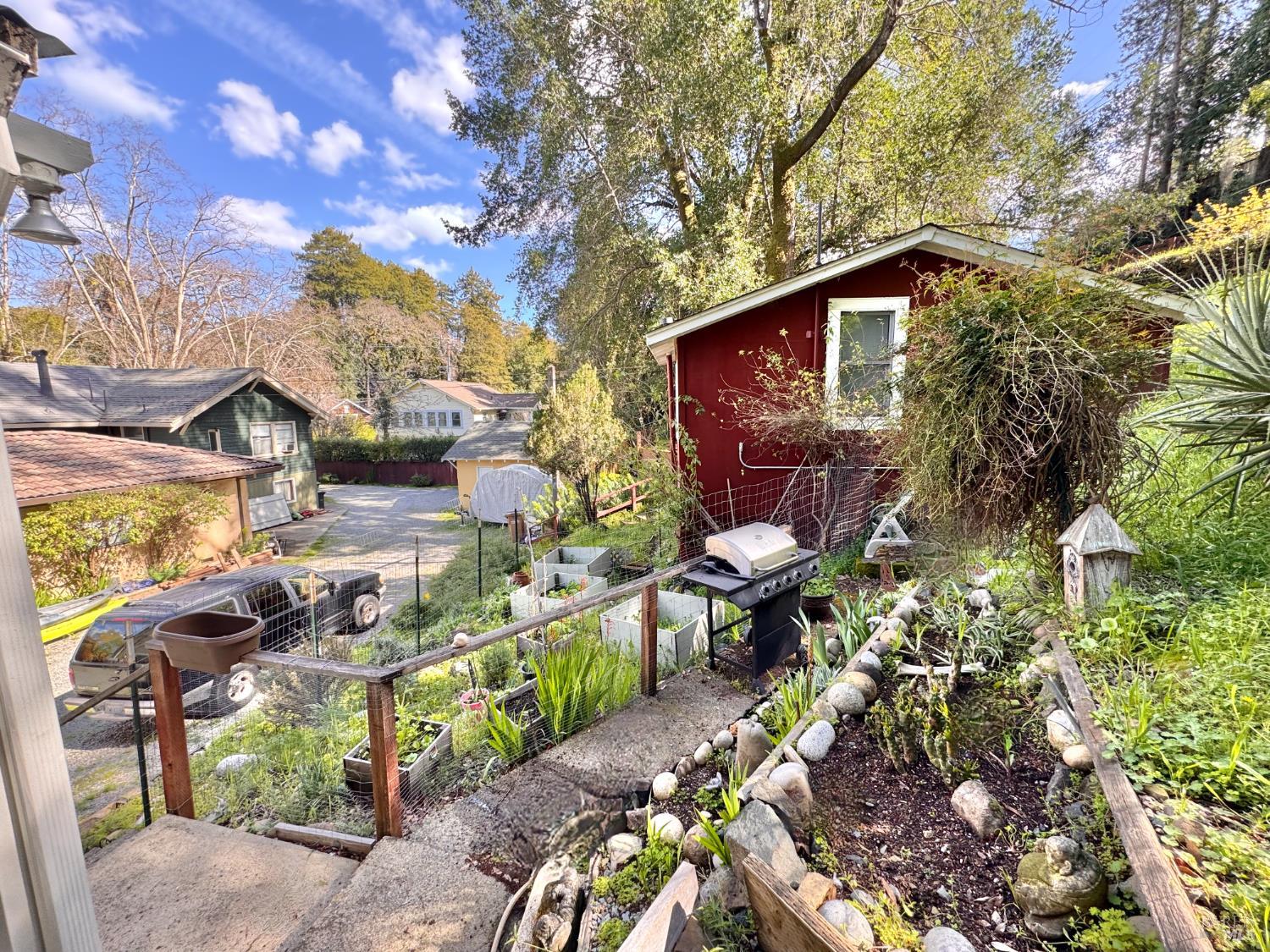 55-61 Park Road Fairfax, CA 94930 - Photo 23 of 26 a backyard of a house with table and chairs