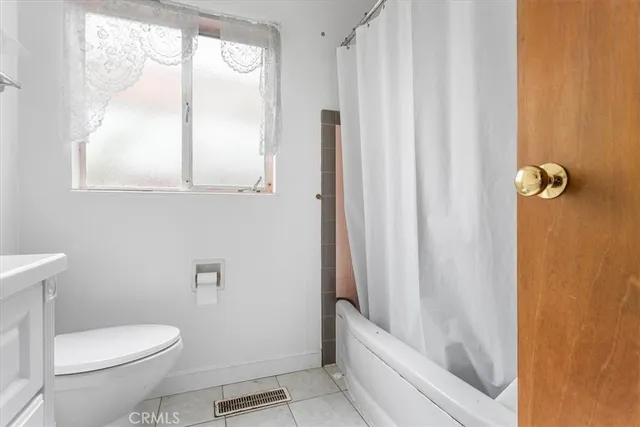 a bathroom with a toilet a sink and a bathtub