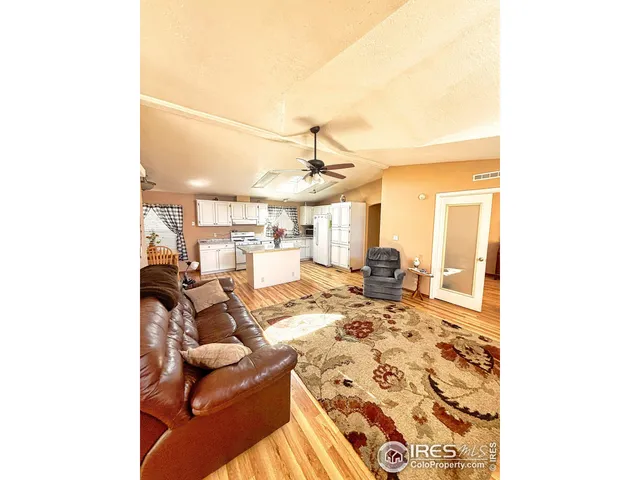 a view of a living room with furniture and a rug