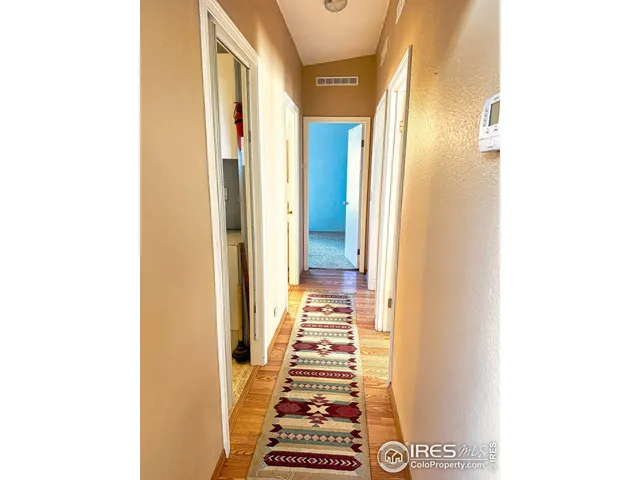 a view of a hallway with windows