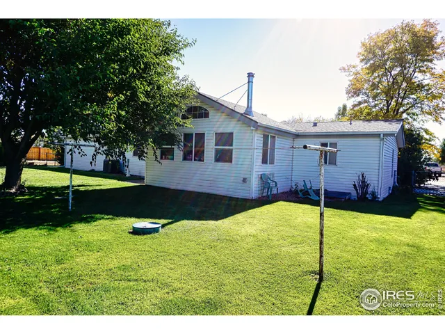 a view of a backyard with a tub