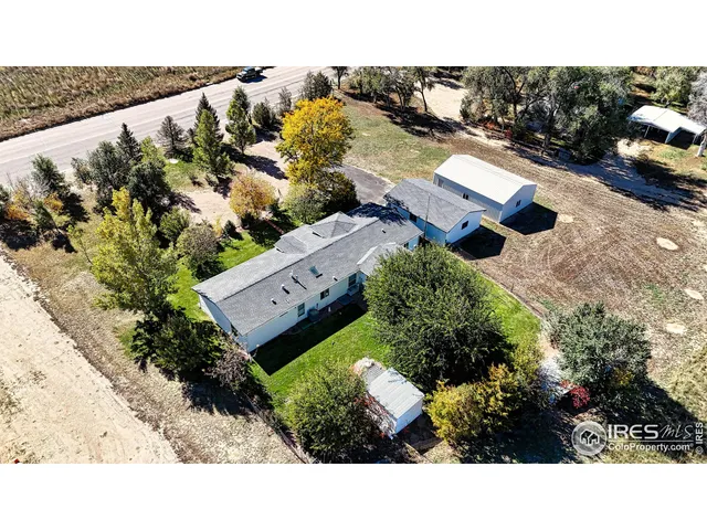 an aerial view of houses with yard