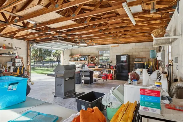 a living room with lots of furniture and a chandelier