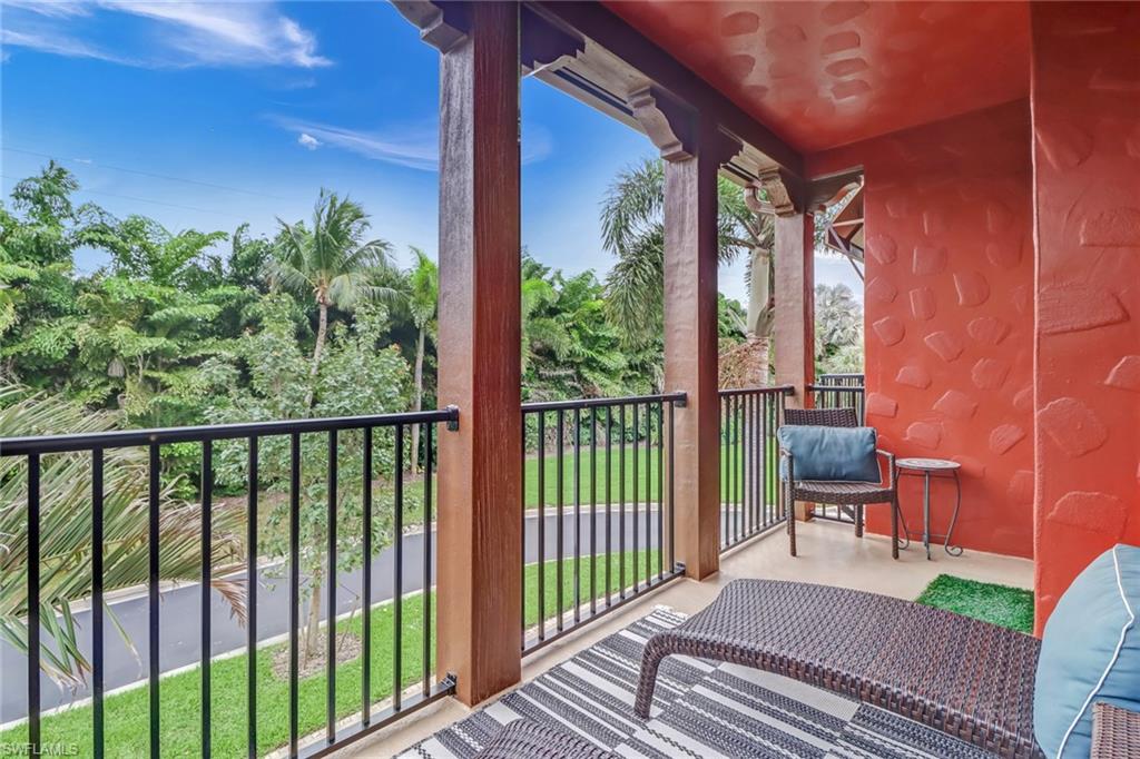 8997 Cambria Circle, Unit 2002 Naples, FL 34113 - Photo 32 of 35 a view of a balcony with chairs