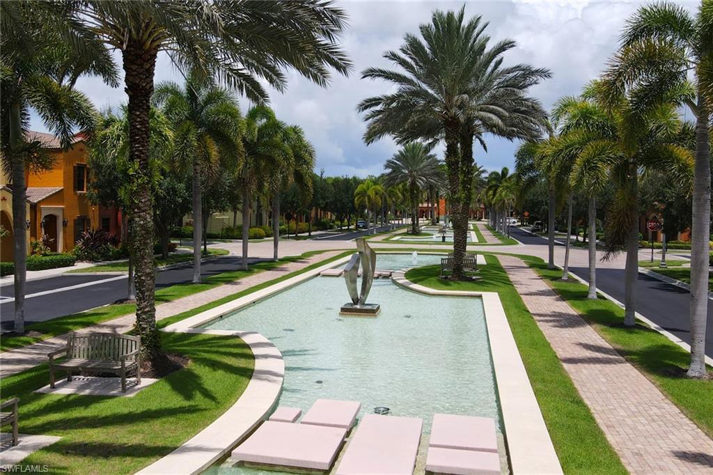 8997 Cambria Circle, Unit 2002 Naples, FL 34113 - Photo 6 of 35 a park with palm trees and palm trees