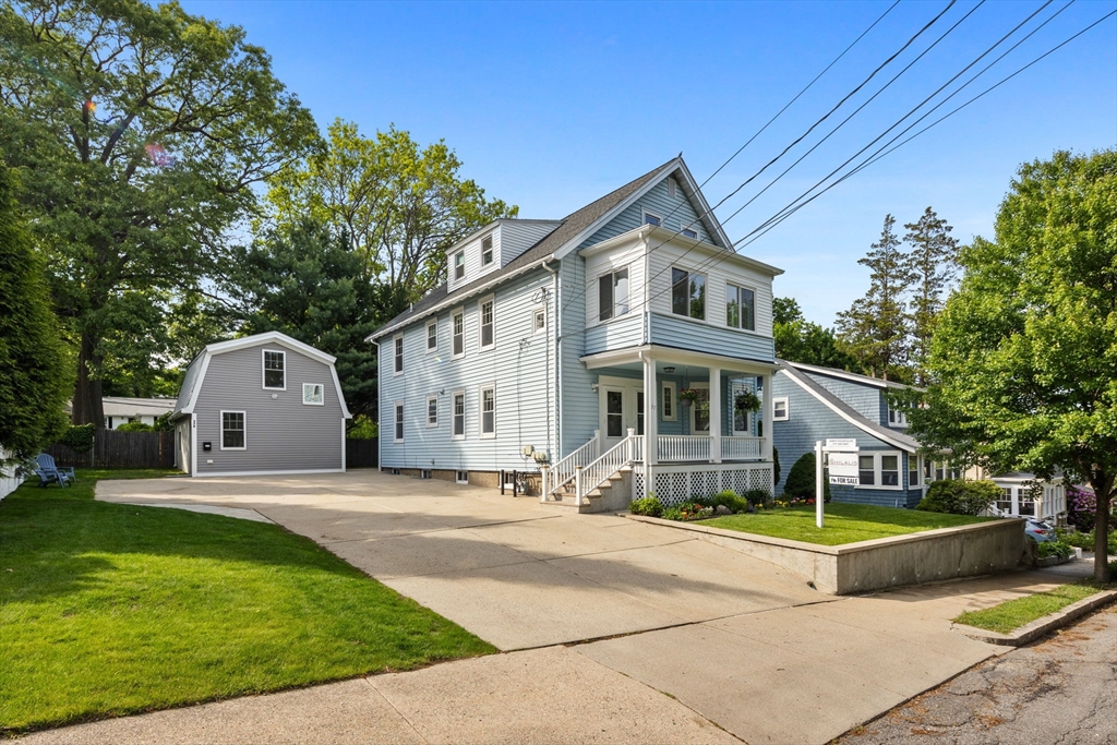 37 Fountain Road, Unit 1 Arlington, MA 02476 - Photo 3 of 19 a front view of a house with a yard