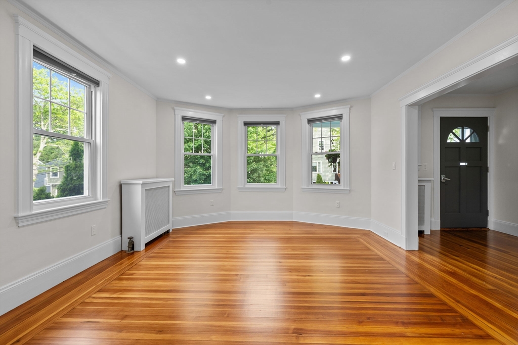 37 Fountain Road, Unit 1 Arlington, MA 02476 - Photo 4 of 19 a view of empty room with wooden floor and fan
