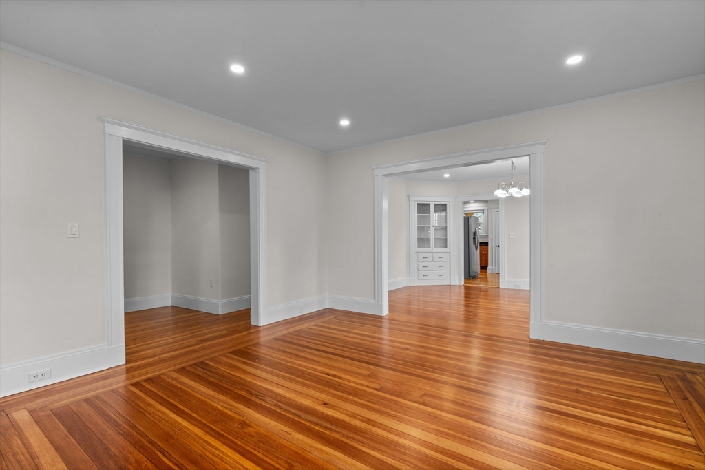 37 Fountain Road, Unit 1 Arlington, MA 02476 - Photo 5 of 19 a view of an empty room with wooden floor and a window