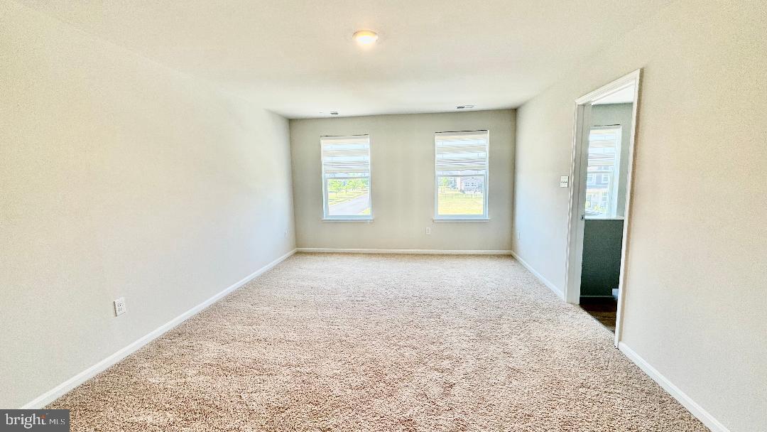 1236 Pimpernell Path Middletown, DE 19709 - Photo 10 of 37 an empty room with windows