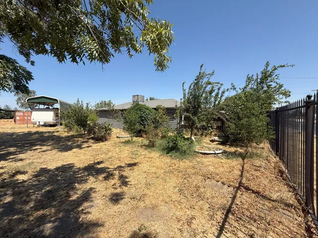 a view of a backyard of the house
