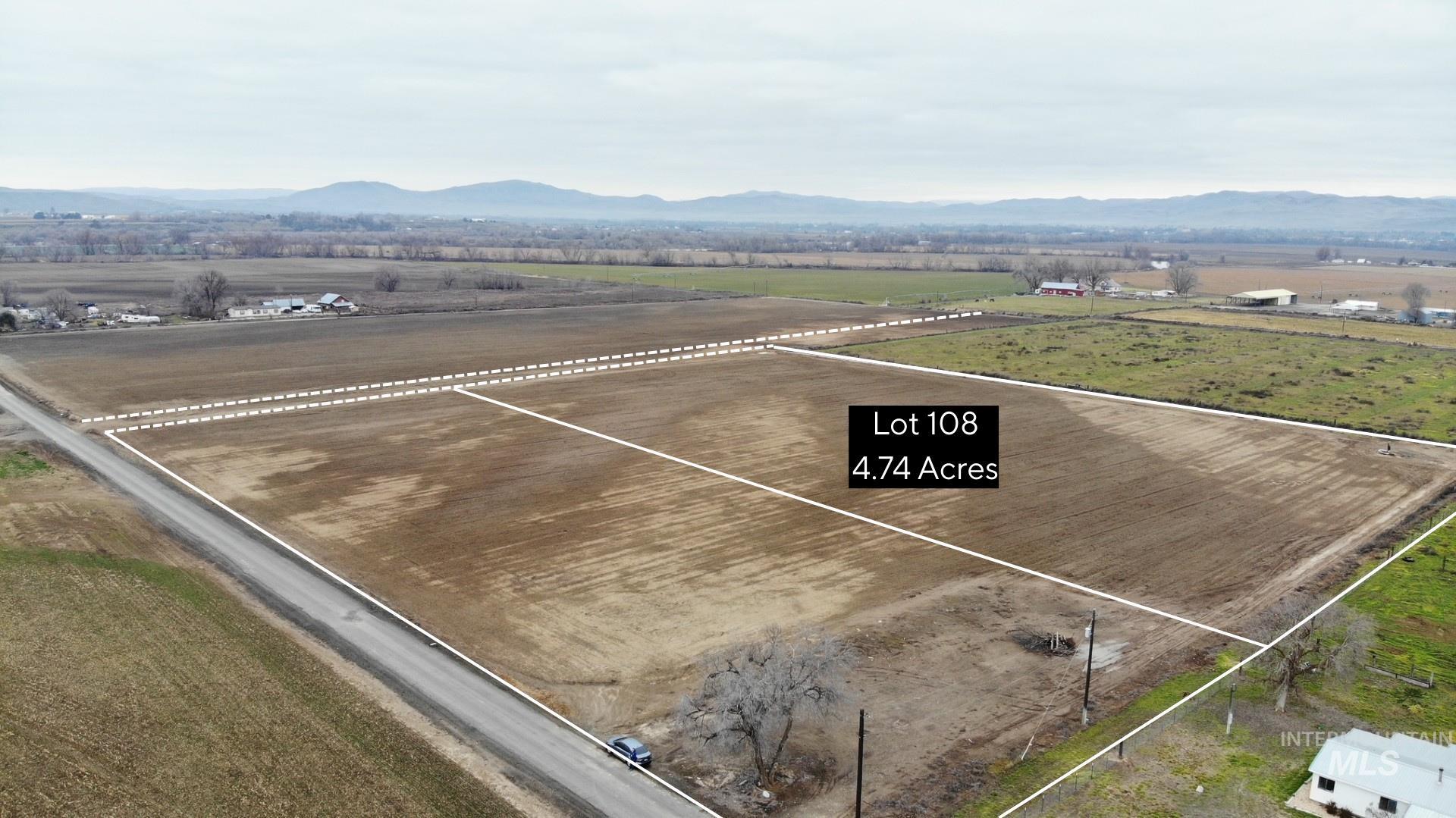 Tbd Tbd Delicious Street Weiser, ID 83672 - Photo 5 of 6 Aerial view of sparsely populated area with property parcel outlined and a mountainous background