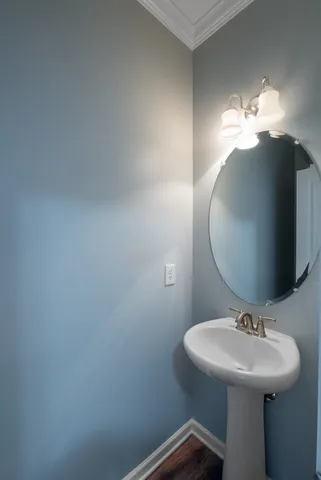 a bathroom with a sink a mirror and vanity