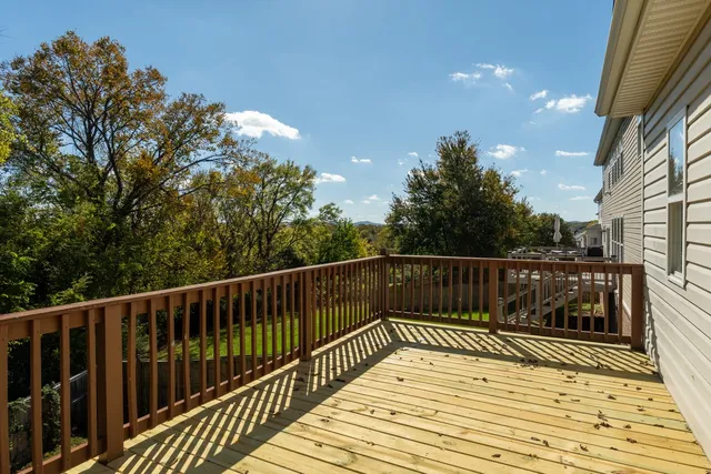 a view of balcony and wooden floor