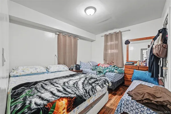 a bedroom with bed and a window