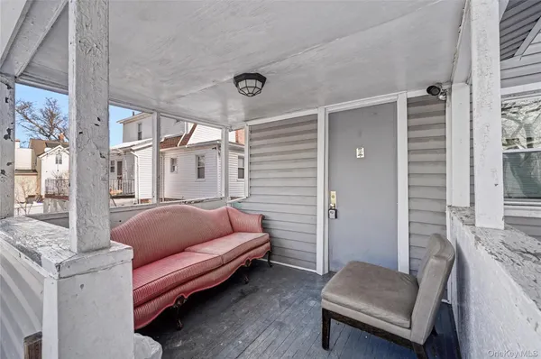 a outdoor living space with furniture and a rug