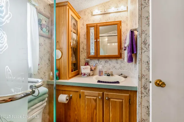 a bathroom with a sink and a mirror