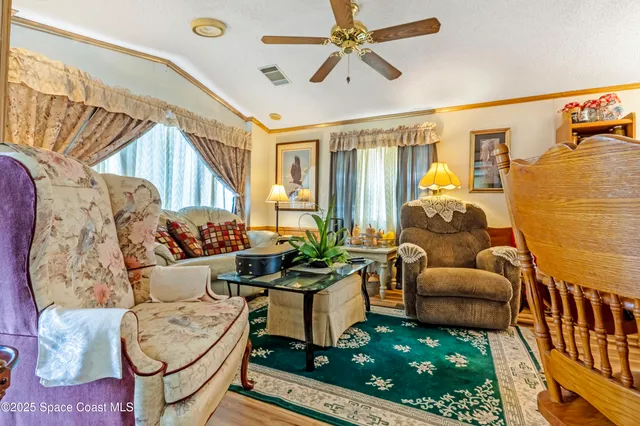 a living room with furniture and a rug