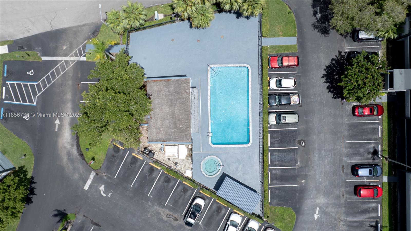 8321 Sands Point Boulevard, Unit D205 Tamarac, FL 33321 - Photo 13 of 18 an aerial view of a residential apartment building with a yard and plants