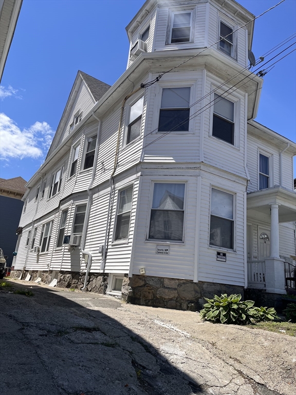 32 Avon Street, Unit 1 Lawrence, MA 01841 - Photo 3 of 4 a front view of a building